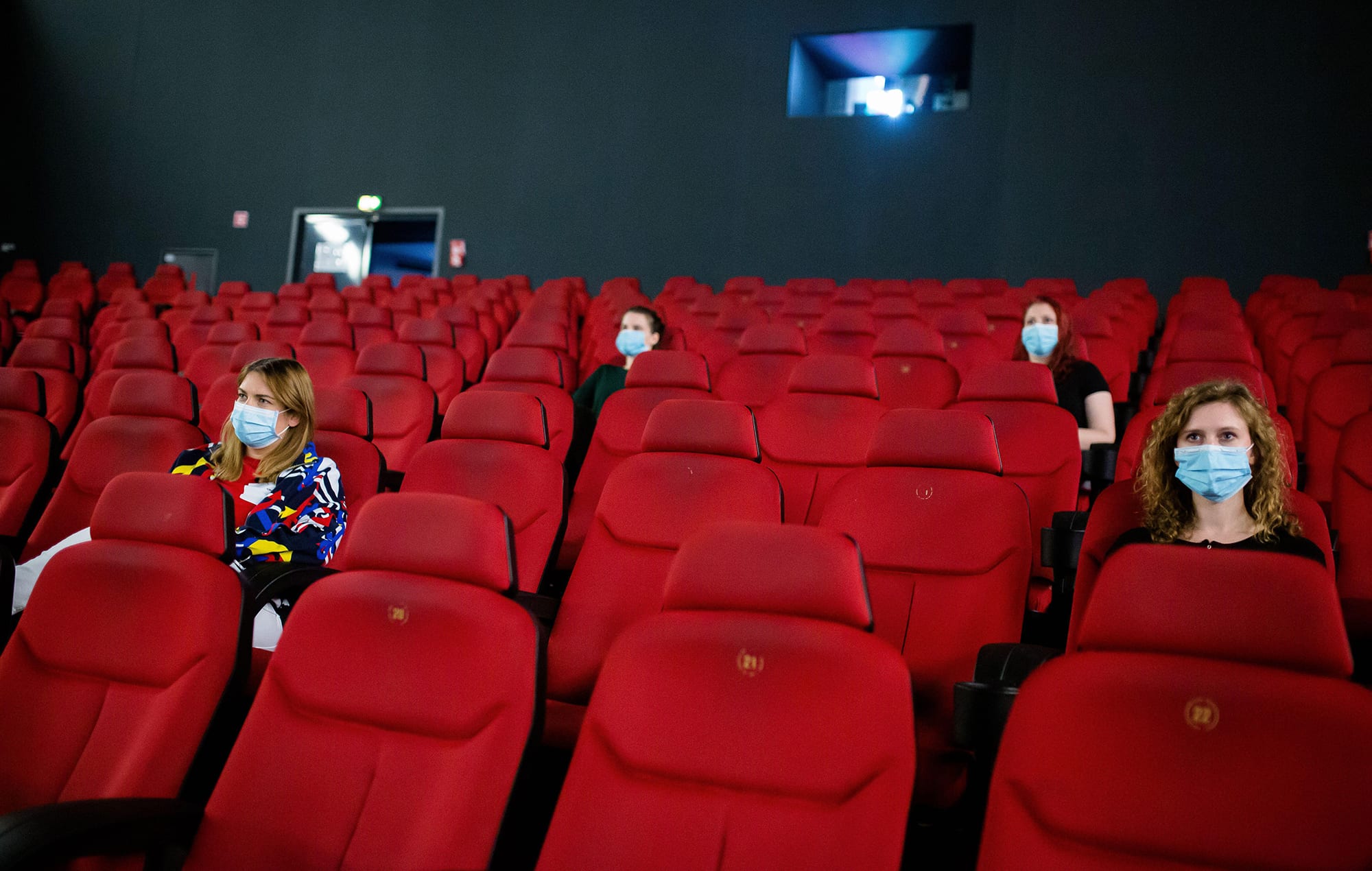 Customers have to keep their social distances in the cinema hall.