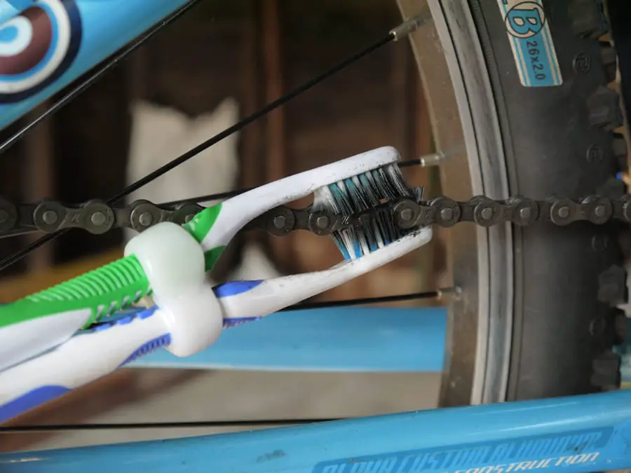 Old Toothbrush Hack #6: Clean The Bike Chain With Two Toothbrushes