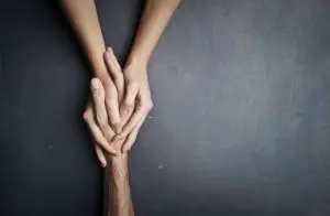 Holding hands as a form of support